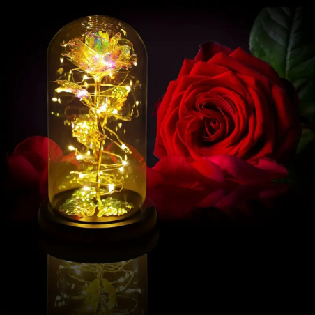 Goldene gläserne Rose im Glas mit LED