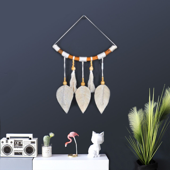 Beautiful hanging decoration made of rattan with feathers